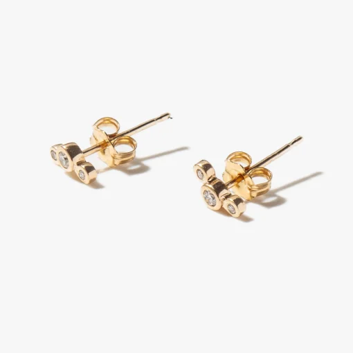 Three Small Graduated Diamond Bezel Studs