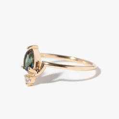Medium Pear Cut Teal Sapphire and Diamond Nestled Ring